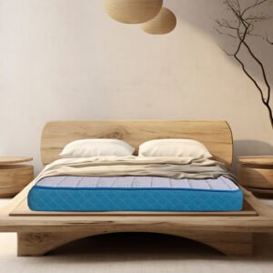 A premium mattress displayed in a serene bedroom setting, emphasizing its spine support features and plush surface, inviting a restful night's sleep.